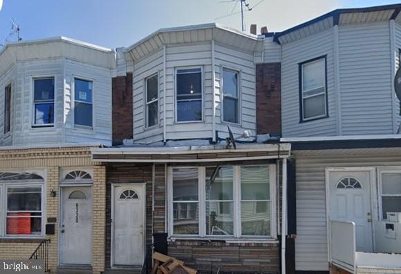 a front view of a building with glass windows