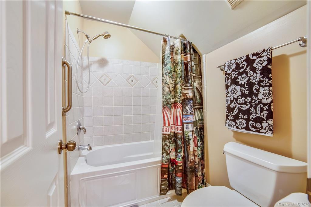 1346 Crown Ridge Drive Fort Mill, SC 29708 - Photo 14 of 36 a bathroom with a toilet and a shower curtain