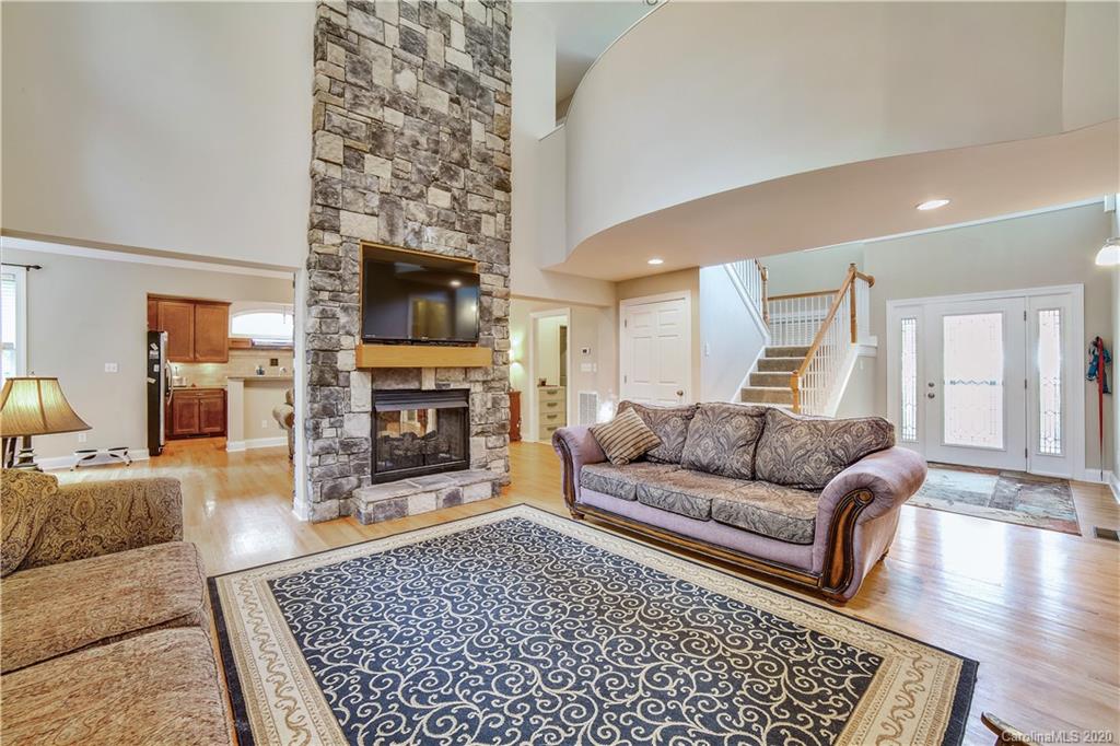 1346 Crown Ridge Drive Fort Mill, SC 29708 - Photo 4 of 36 a living room with furniture and a fireplace