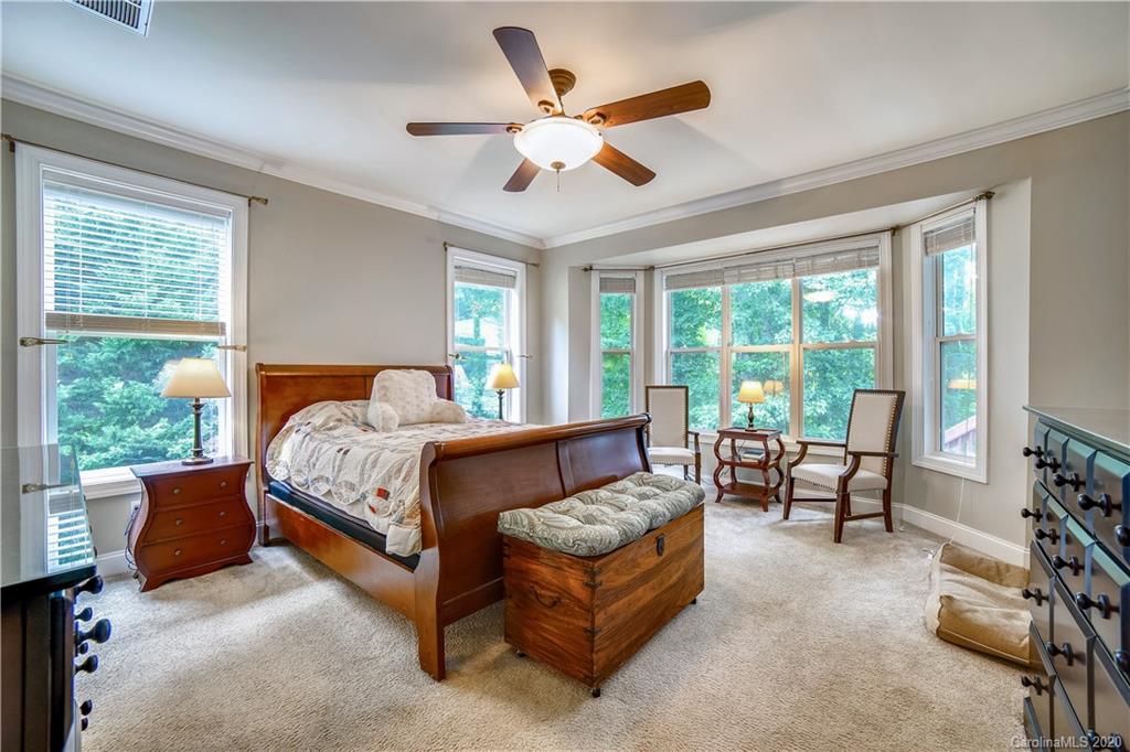 1346 Crown Ridge Drive Fort Mill, SC 29708 - Photo 8 of 36 a bedroom with a bed couch and window