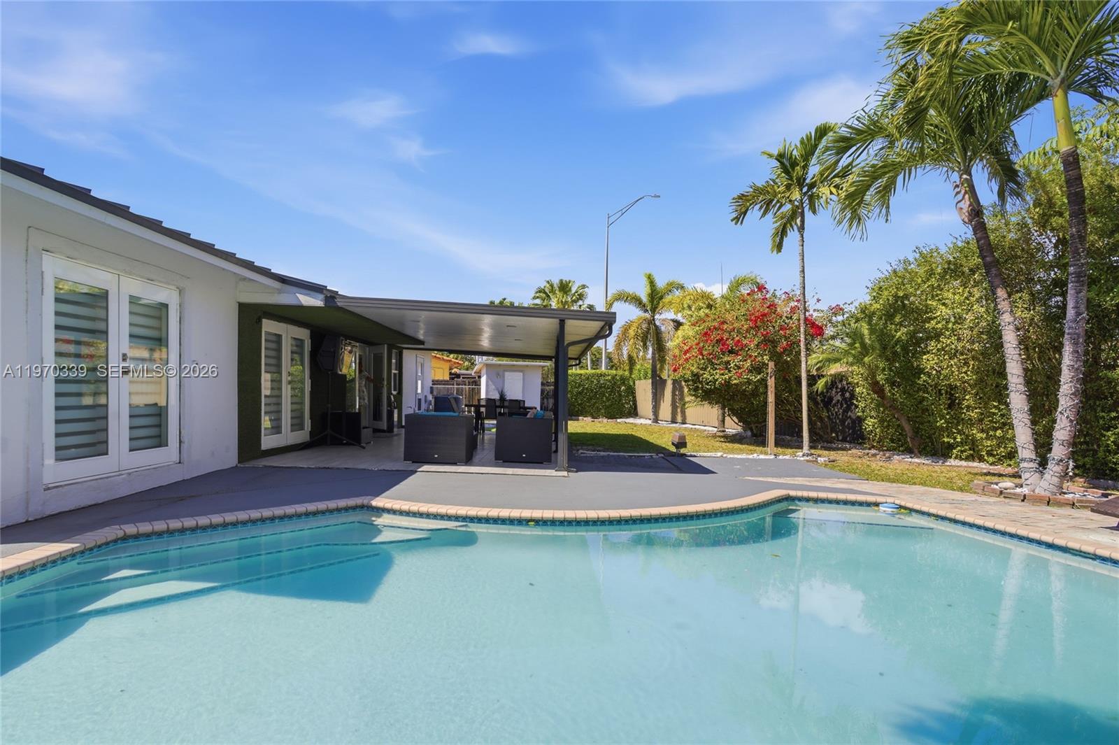 a house with palm tree in front of it