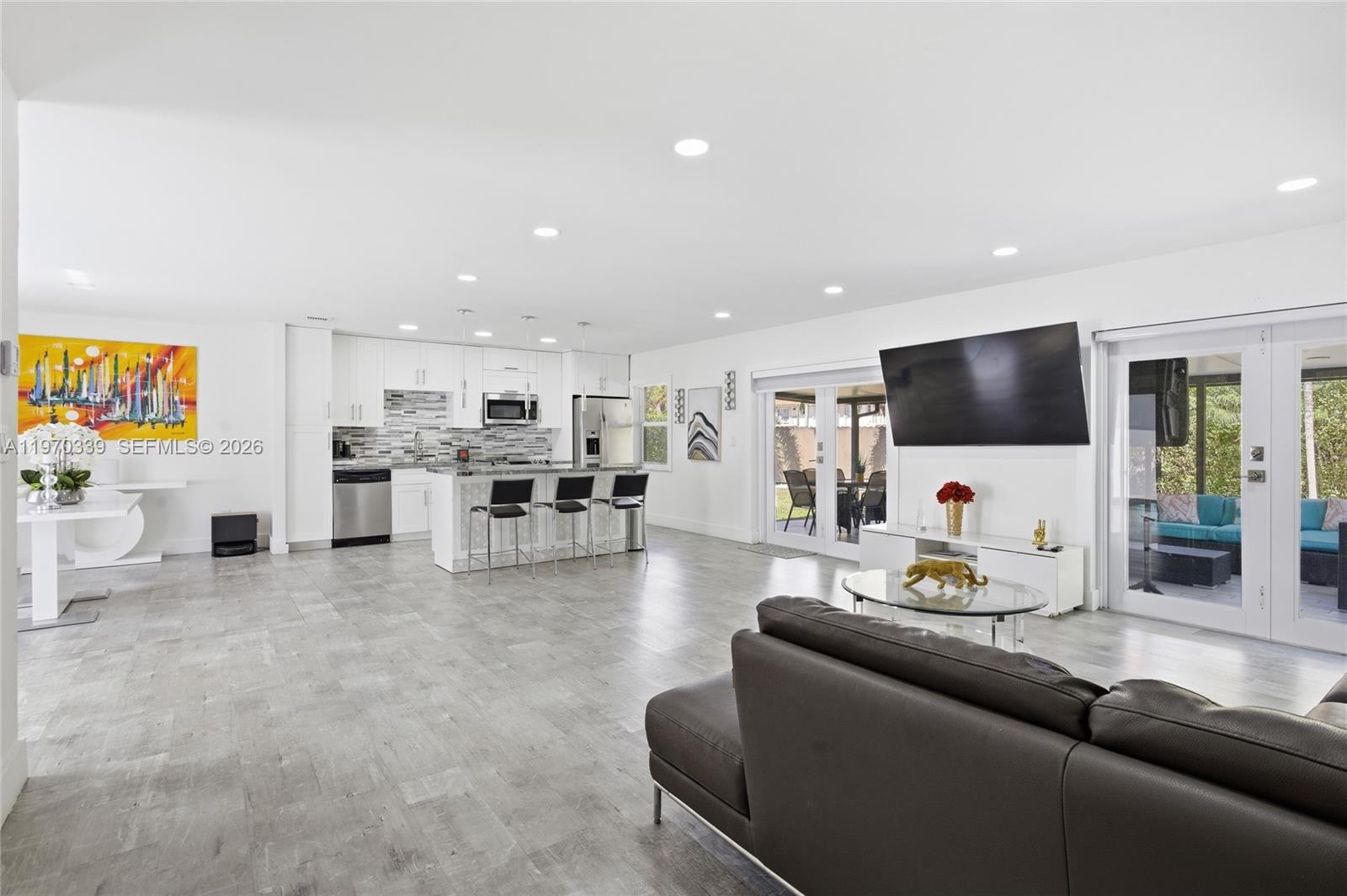 12845 Southwest 72nd Terrace Miami, FL 33183 - Photo 13 of 33 a living room with furniture and a flat screen tv