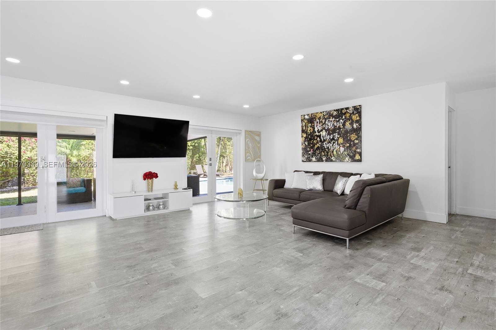 12845 Southwest 72nd Terrace Miami, FL 33183 - Photo 15 of 33 a living room with furniture and a flat screen tv