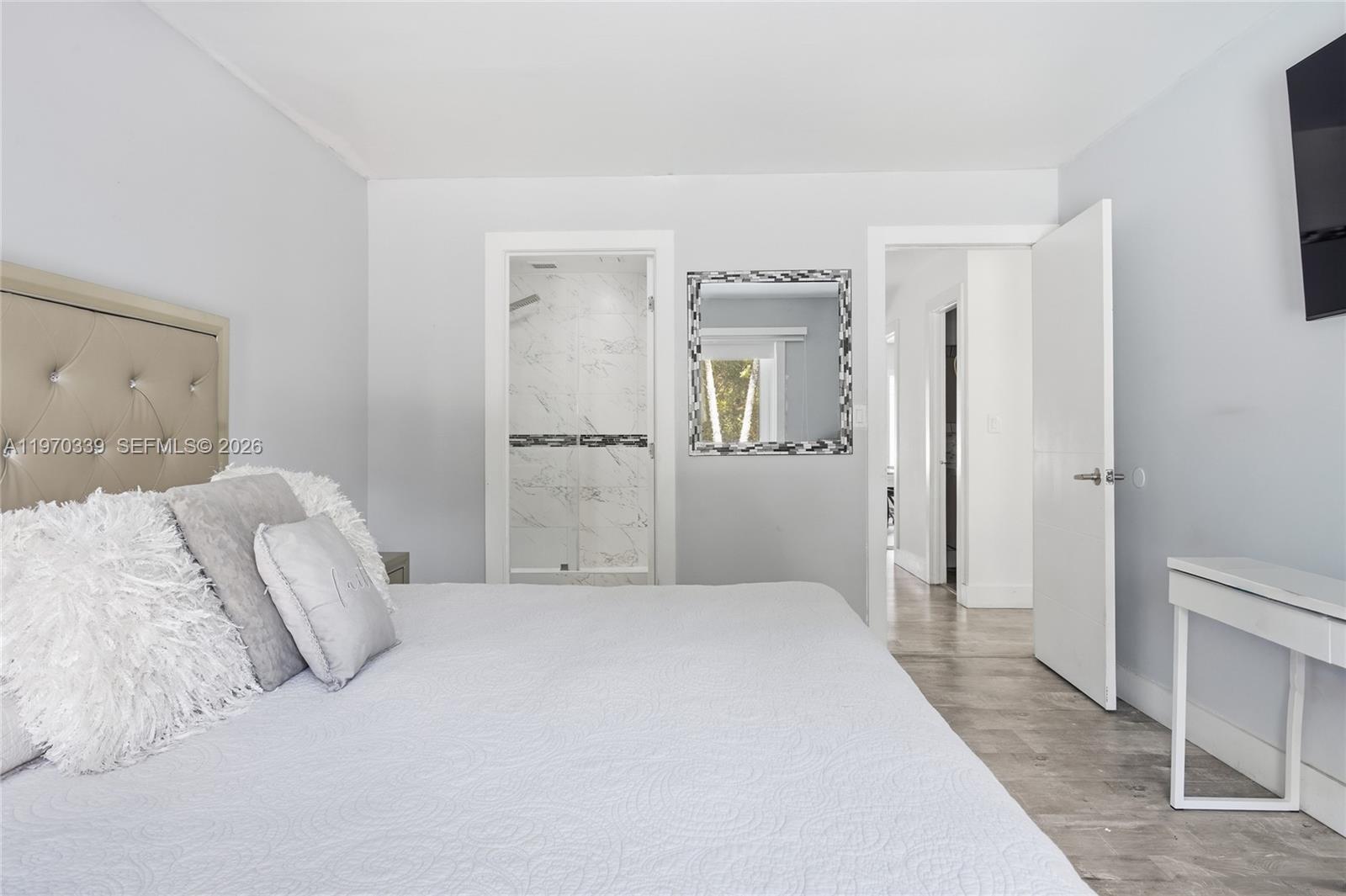 12845 Southwest 72nd Terrace Miami, FL 33183 - Photo 19 of 33 a bedroom with a bed and a mirror