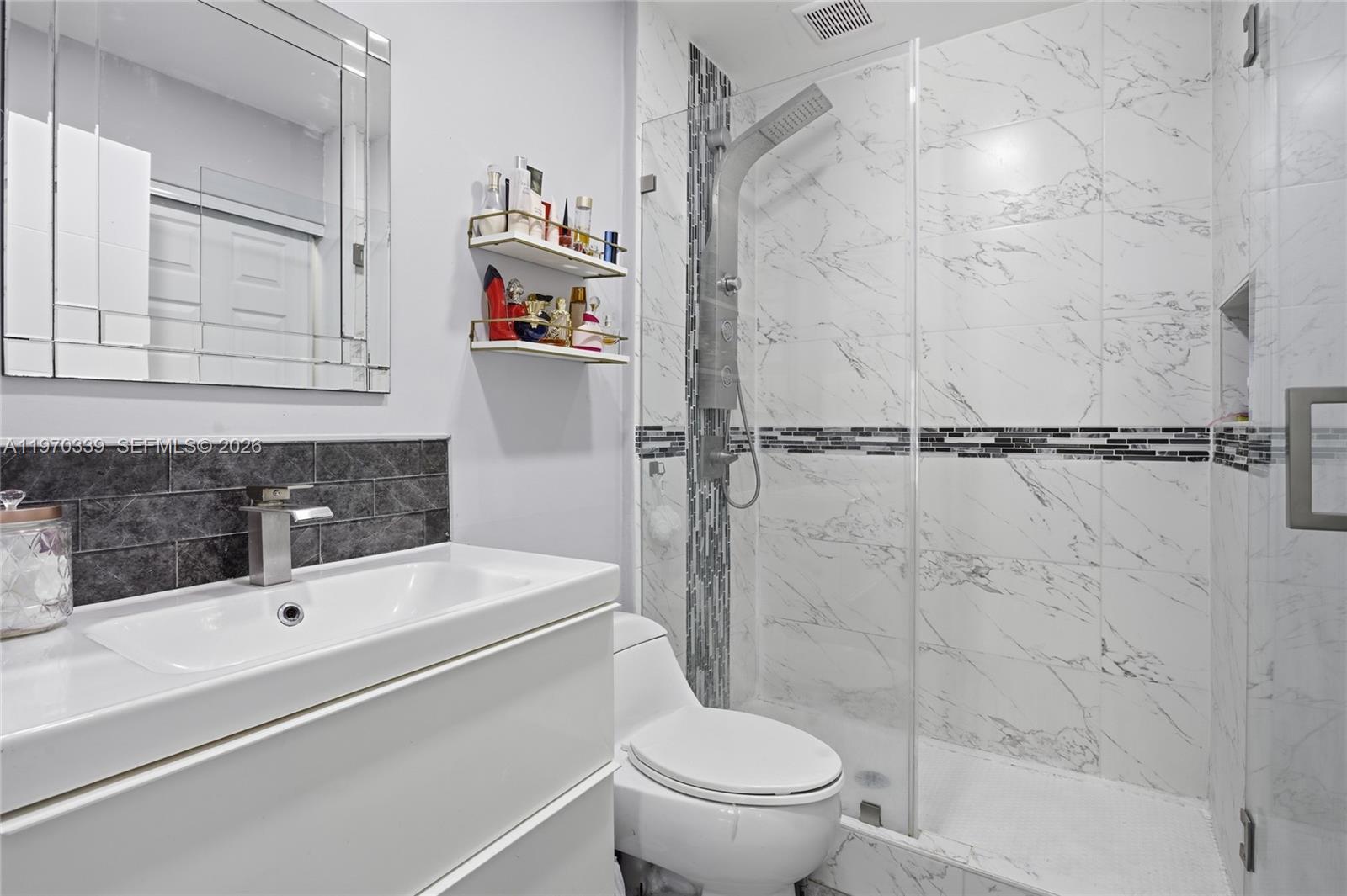 12845 Southwest 72nd Terrace Miami, FL 33183 - Photo 20 of 33 a bathroom with a sink a toilet and a shower