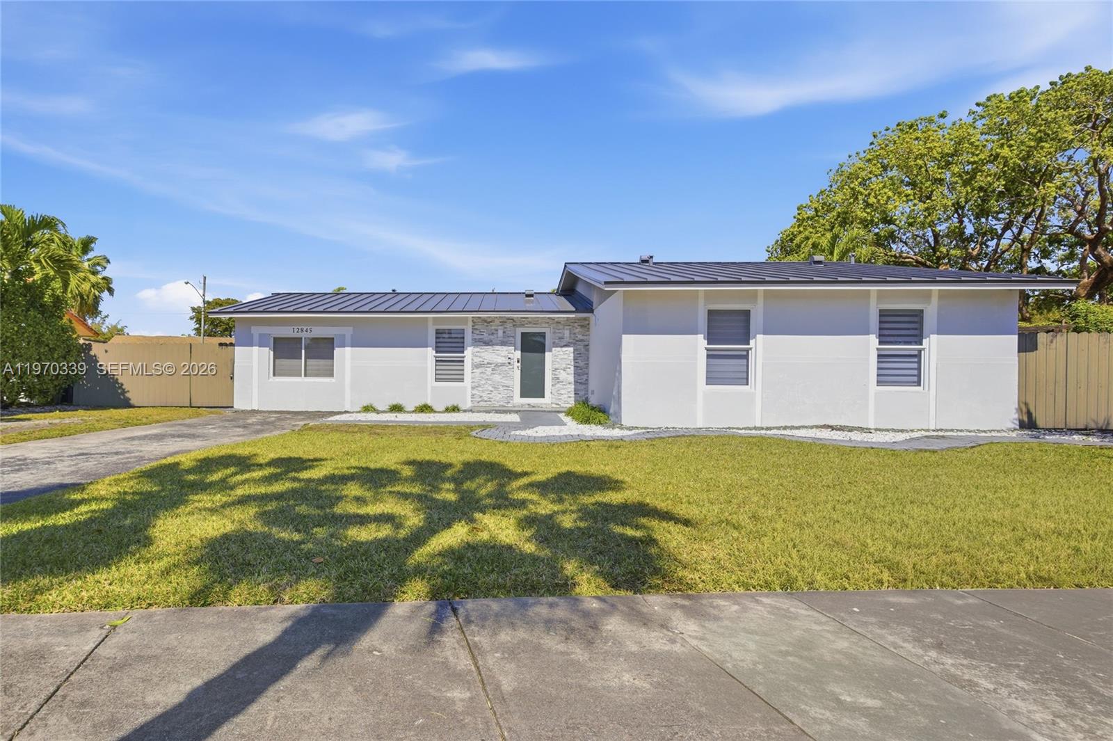 12845 Southwest 72nd Terrace Miami, FL 33183 - Photo 2 of 33 a house with swimming pool in front of it
