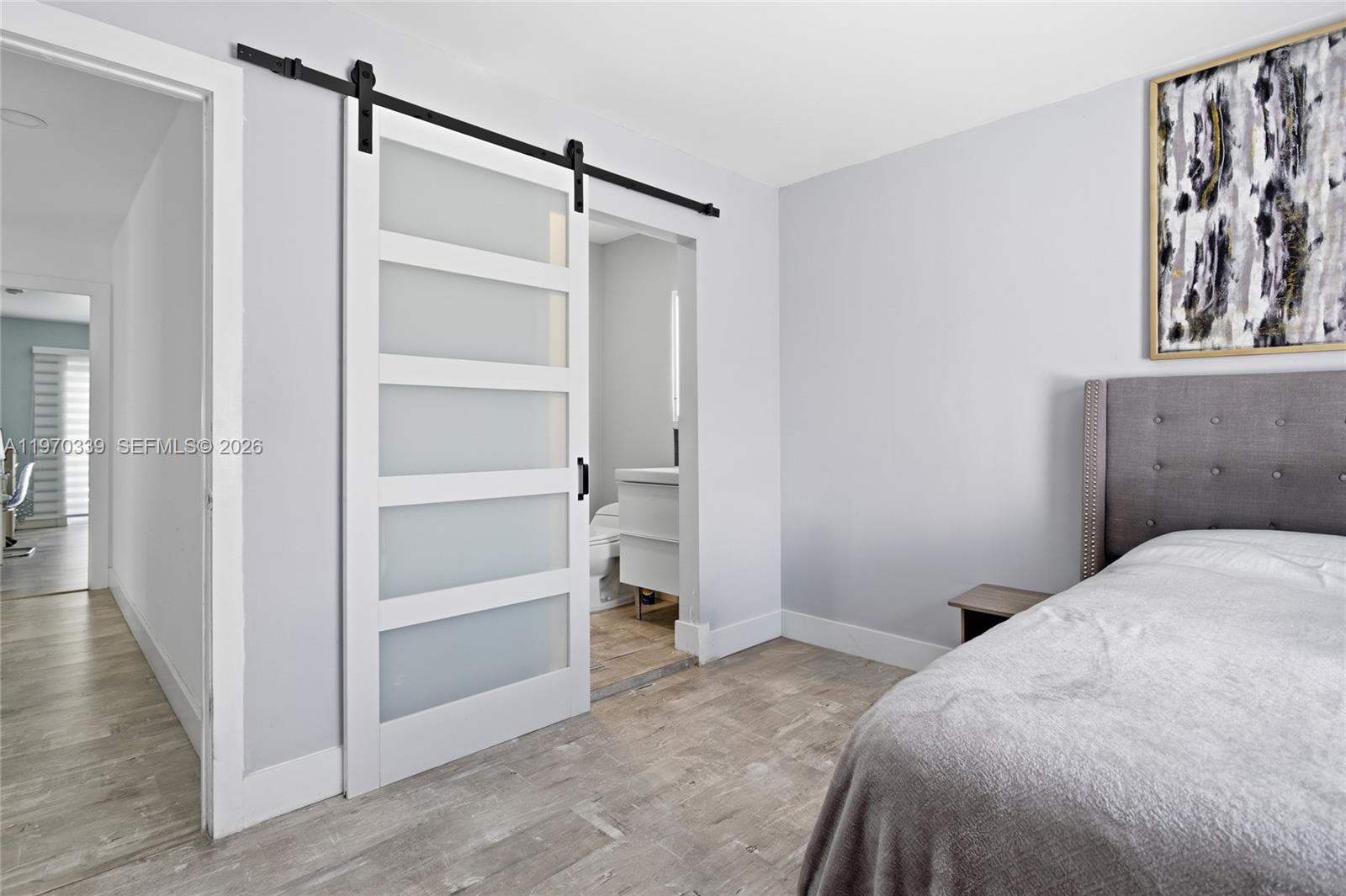 12845 Southwest 72nd Terrace Miami, FL 33183 - Photo 21 of 33 a bedroom with a bed and a walk in closet