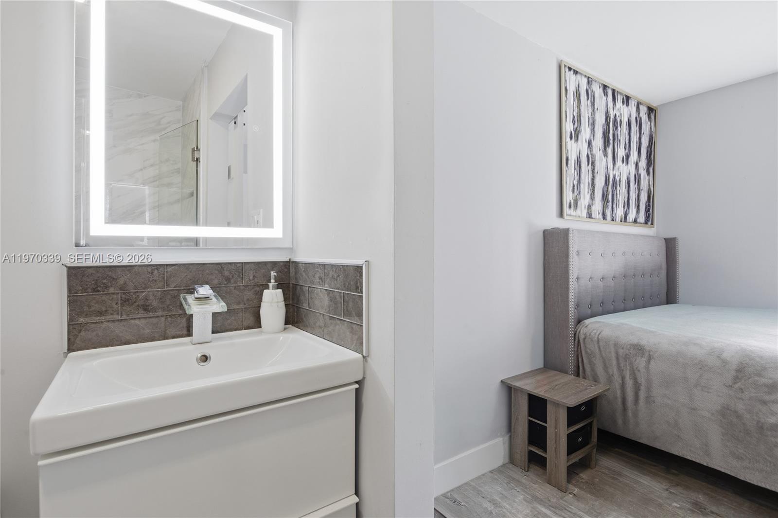 12845 Southwest 72nd Terrace Miami, FL 33183 - Photo 22 of 33 a bathroom with a sink and a mirror