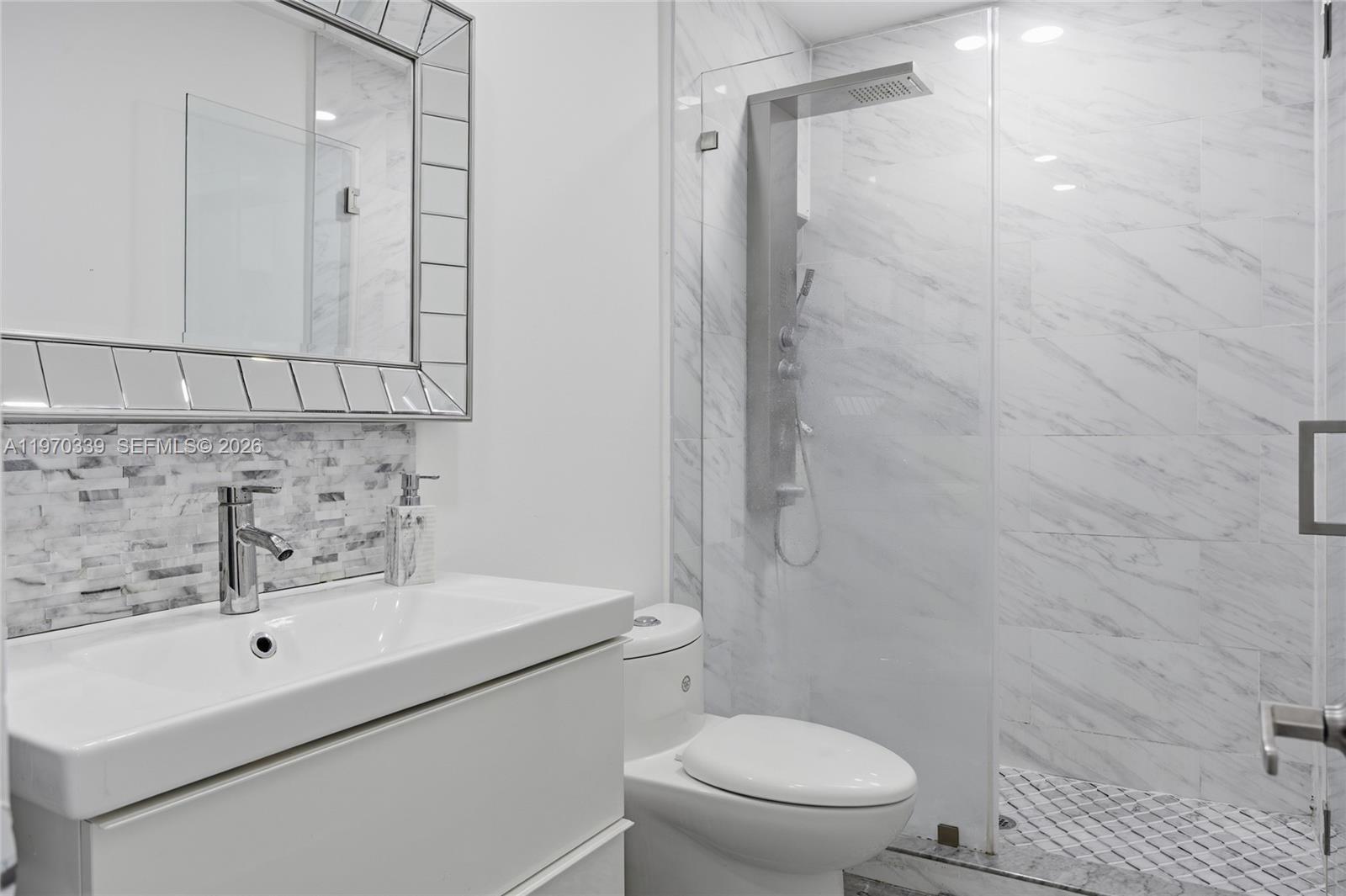 12845 Southwest 72nd Terrace Miami, FL 33183 - Photo 26 of 33 a bathroom with a sink toilet and shower