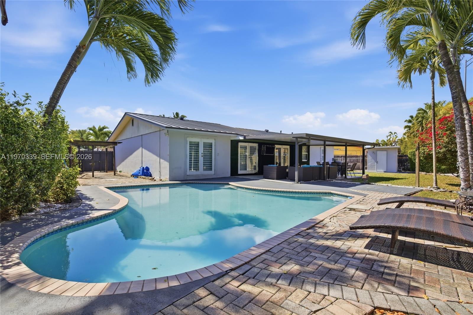 12845 Southwest 72nd Terrace Miami, FL 33183 - Photo 3 of 33 a view of a house with swimming pool and sitting area