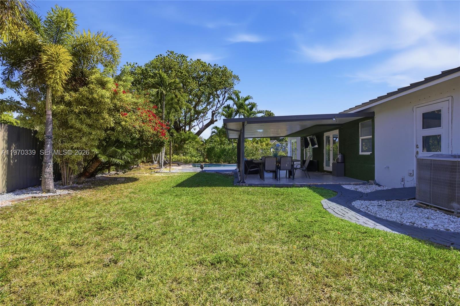 12845 Southwest 72nd Terrace Miami, FL 33183 - Photo 8 of 33 a view of a house with backyard porch and sitting area