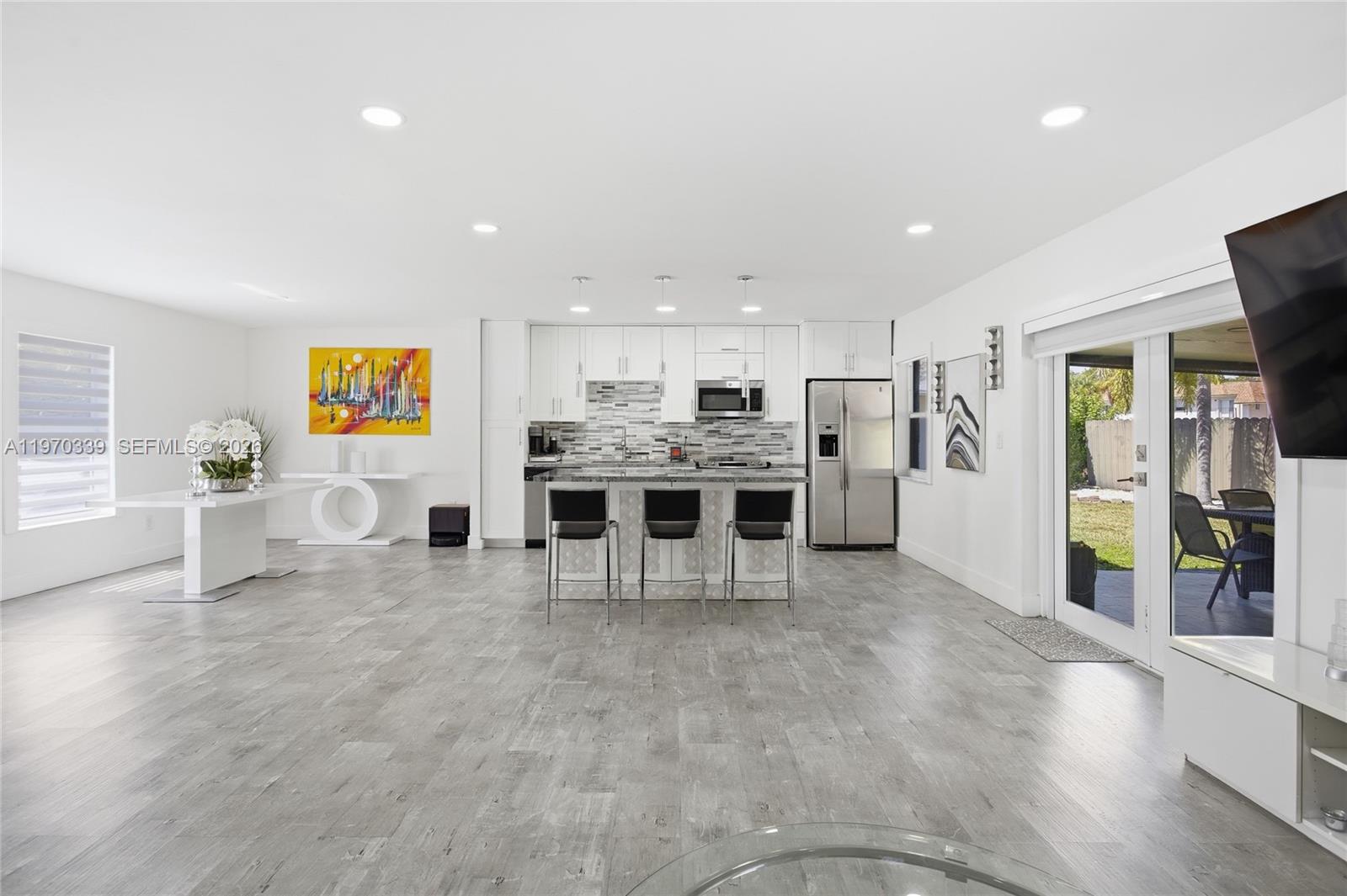 12845 Southwest 72nd Terrace Miami, FL 33183 - Photo 9 of 33 a view of a kitchen with stainless steel appliances refrigerator stove microwave and cabinets