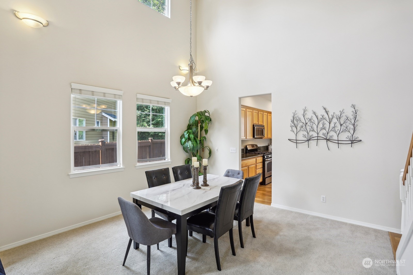 22712 30th Court Southeast Bothell, WA 98021 - Photo 12 of 38 a view of a dining room with furniture and chandelier