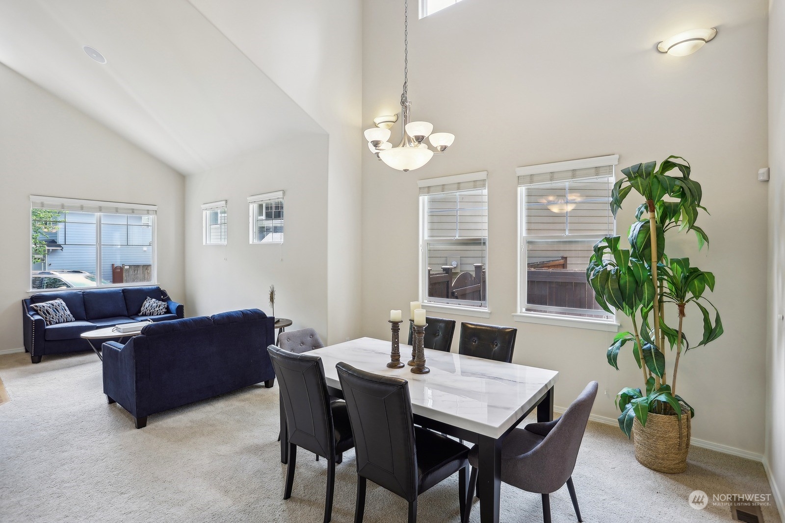 22712 30th Court Southeast Bothell, WA 98021 - Photo 14 of 38 a view of a dining room with furniture a chandelier and a window