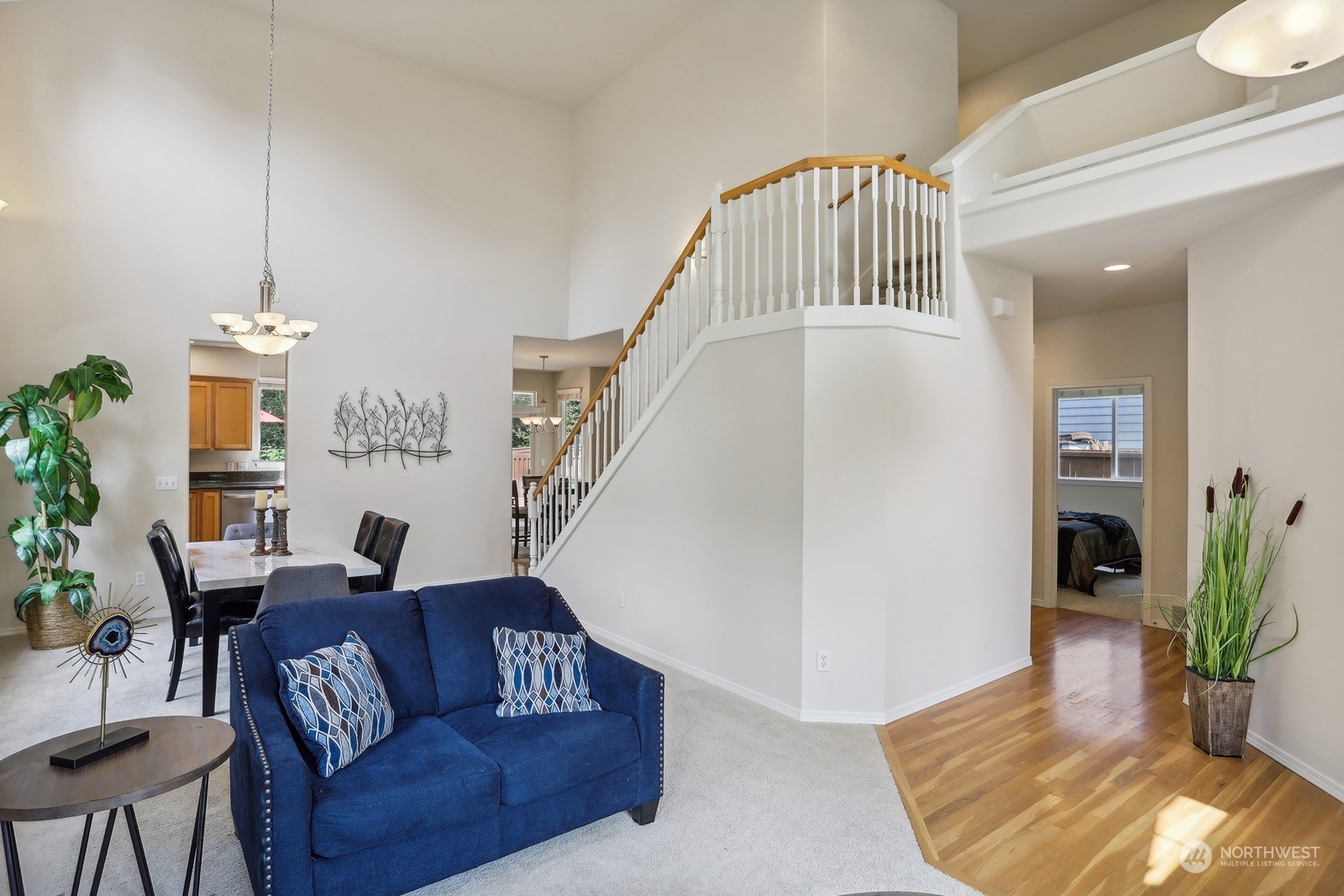 22712 30th Court Southeast Bothell, WA 98021 - Photo 17 of 38 a living room with furniture and a chandelier