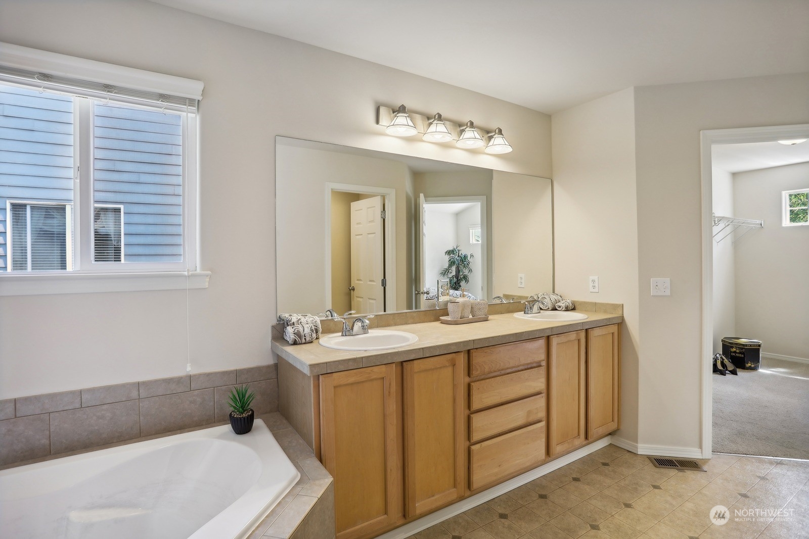 22712 30th Court Southeast Bothell, WA 98021 - Photo 26 of 38 a bathroom with a sink and a mirror