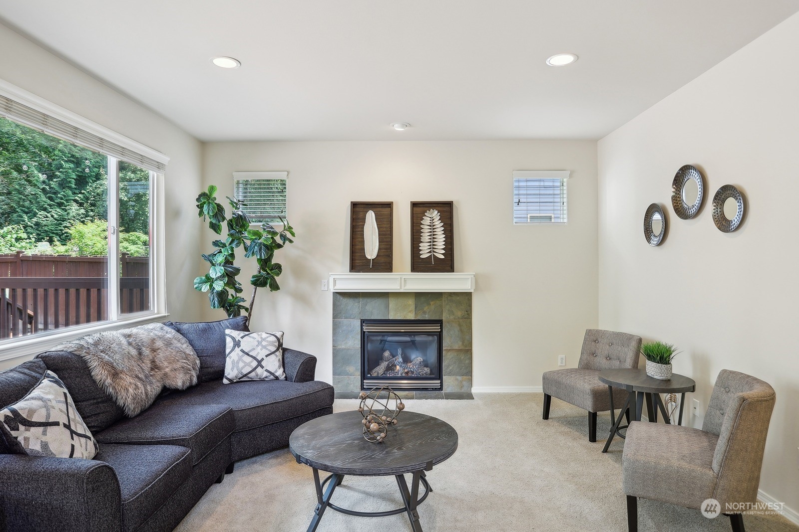 22712 30th Court Southeast Bothell, WA 98021 - Photo 3 of 38 a living room with furniture and a fireplace