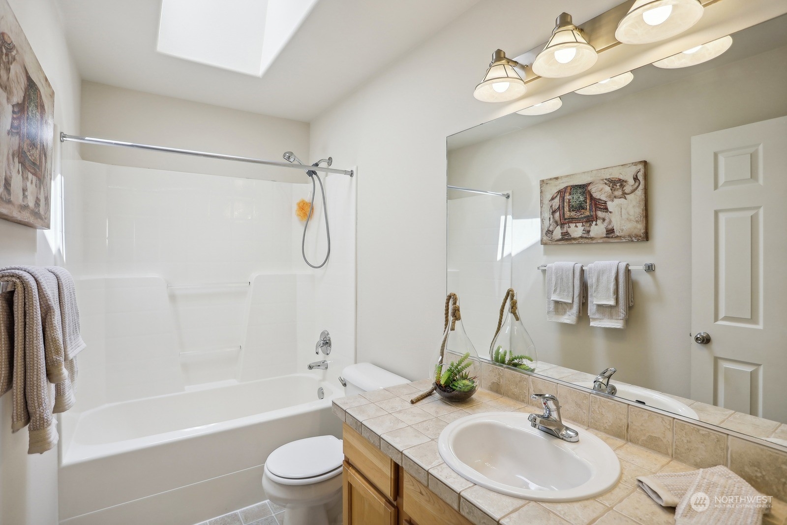 22712 30th Court Southeast Bothell, WA 98021 - Photo 31 of 38 a bathroom with a sink a toilet tub and shower