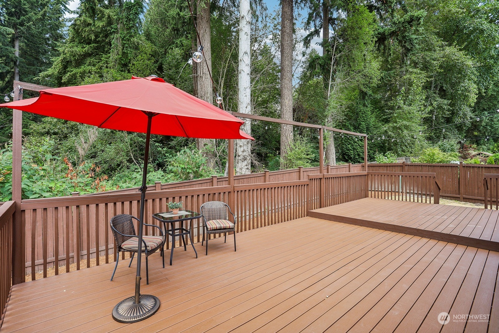 22712 30th Court Southeast Bothell, WA 98021 - Photo 34 of 38 a view of balcony with wooden floor and umbrella