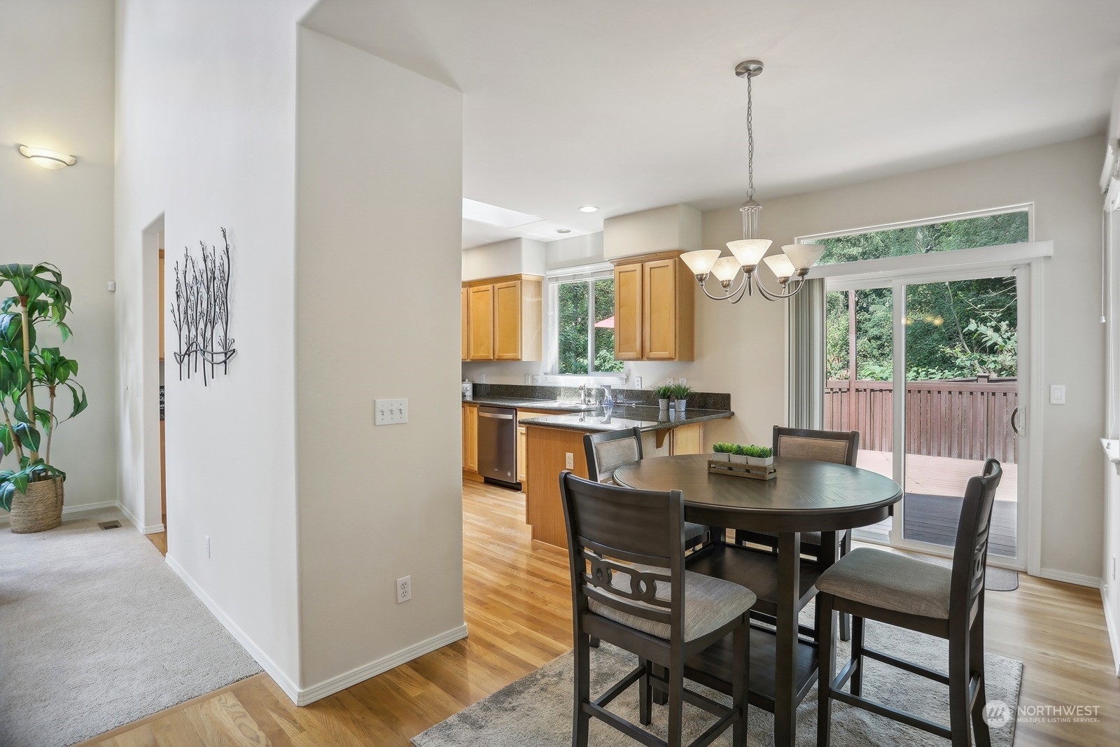 22712 30th Court Southeast Bothell, WA 98021 - Photo 6 of 38 a dining room with furniture a chandelier and wooden floor