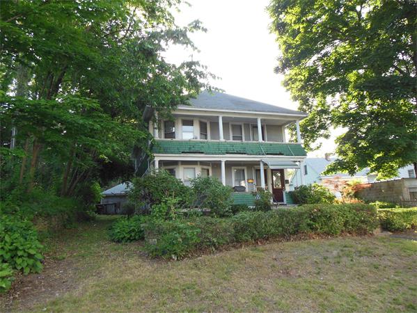 88-90 Pinevale Street Springfield, MA 01151 - Photo 2 of 2 a front view of a house with a garden
