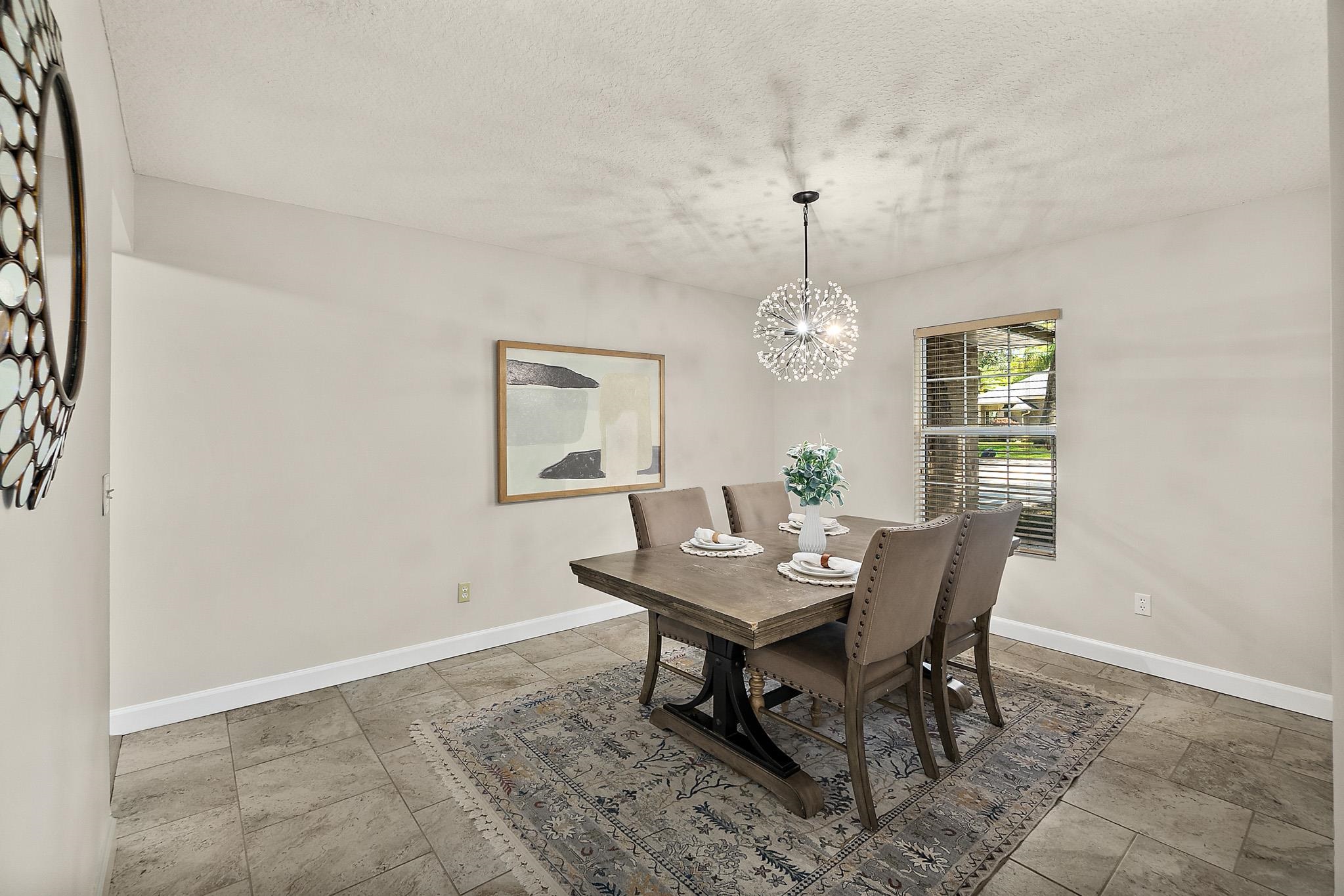 3253 Turtle Creek Road St. Augustine, FL 32086 - Photo 13 of 40 a view of a dining room with furniture and chandelier