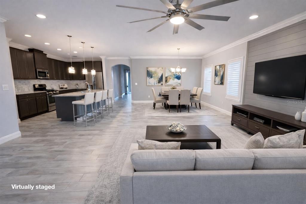 6204 Colmar Place Apollo Beach, FL 33572 - Photo 15 of 57 a living room with furniture and a flat screen tv