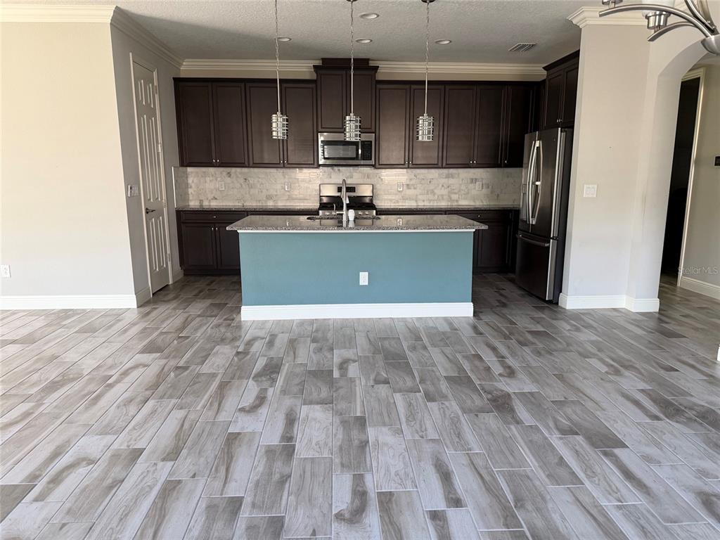 6204 Colmar Place Apollo Beach, FL 33572 - Photo 18 of 57 a view of kitchen with cabinets and stainless steel appliances