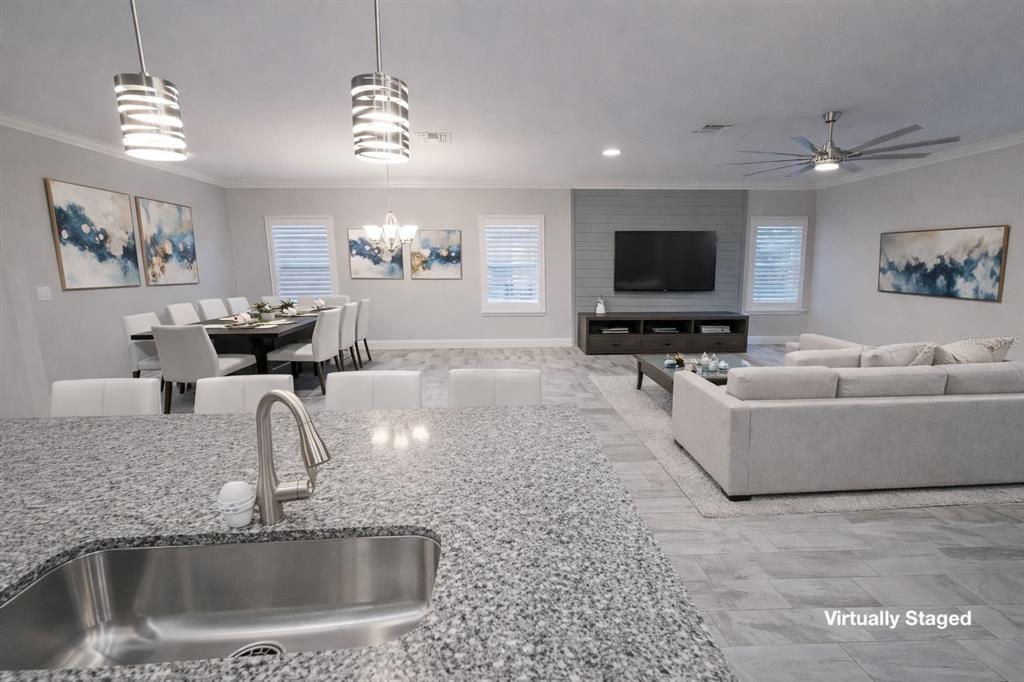 6204 Colmar Place Apollo Beach, FL 33572 - Photo 19 of 57 a living room with furniture and a flat screen tv