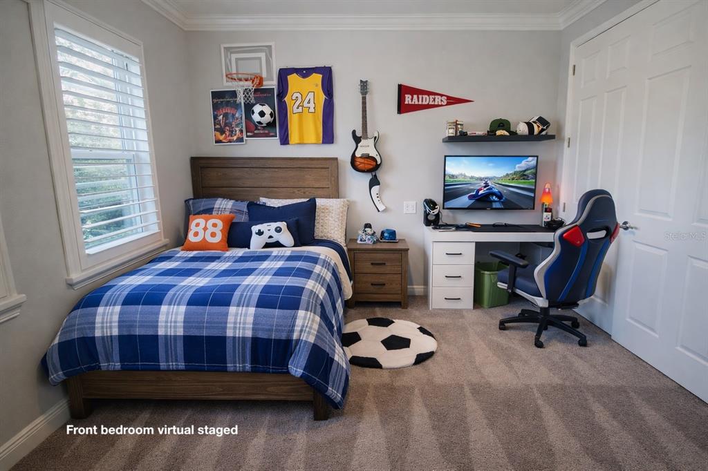 6204 Colmar Place Apollo Beach, FL 33572 - Photo 26 of 57 a bedroom with a bed and a desk