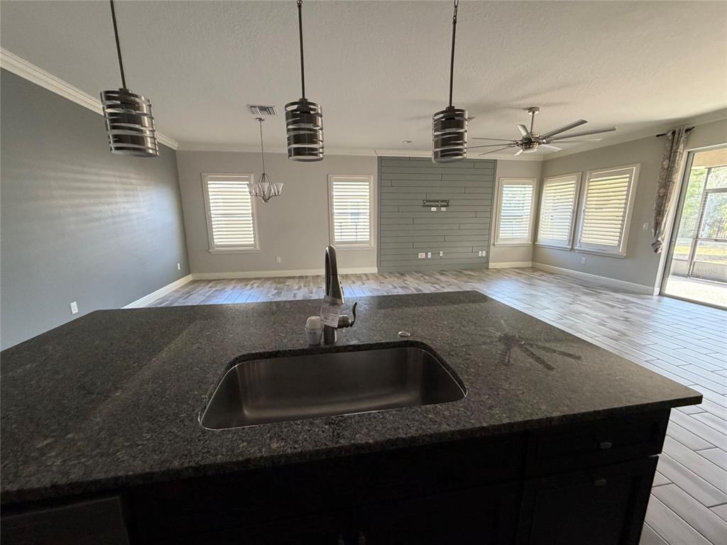 6204 Colmar Place Apollo Beach, FL 33572 - Photo 34 of 57 a kitchen with sink and window