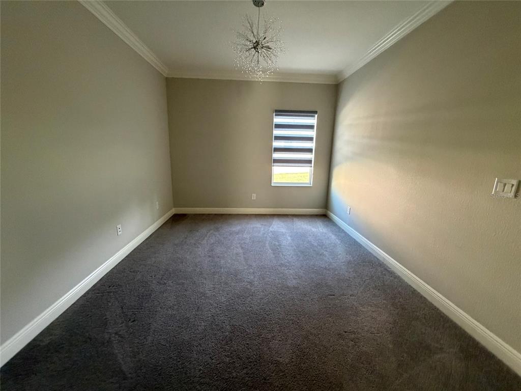 6204 Colmar Place Apollo Beach, FL 33572 - Photo 39 of 57 an empty room with a window and a ceiling fan
