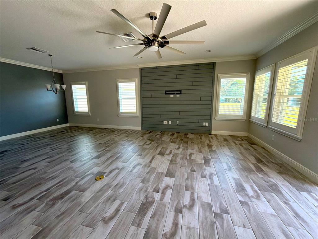 6204 Colmar Place Apollo Beach, FL 33572 - Photo 45 of 57 a view of an empty room with a window and wooden floor