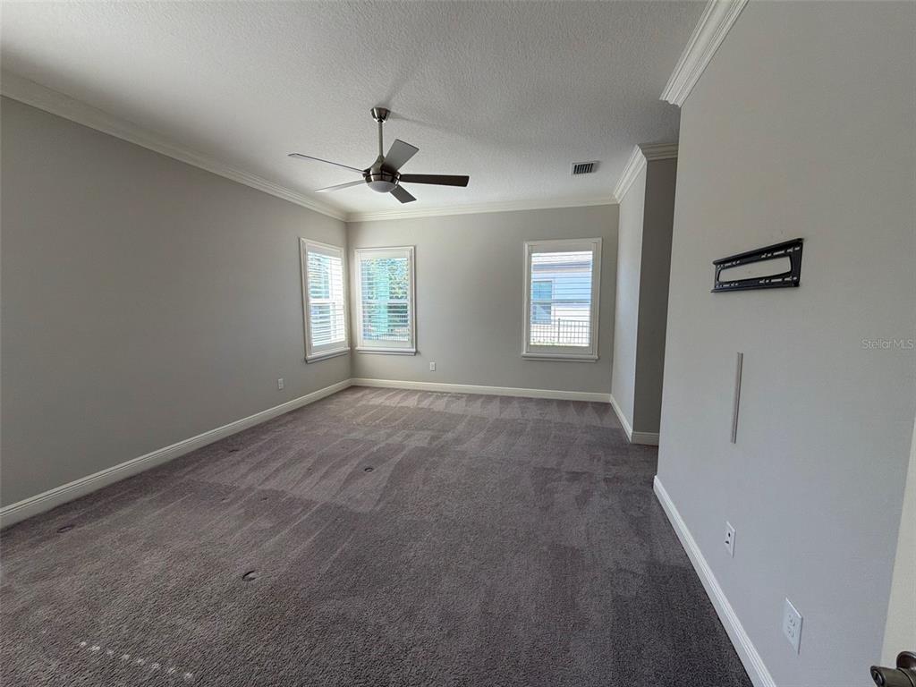 6204 Colmar Place Apollo Beach, FL 33572 - Photo 46 of 57 a view of empty room with windows and ceiling fan