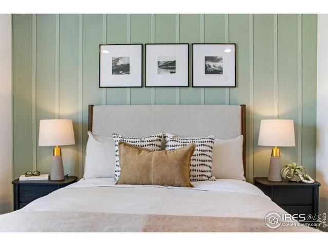 a bedroom with a bed and a lamp