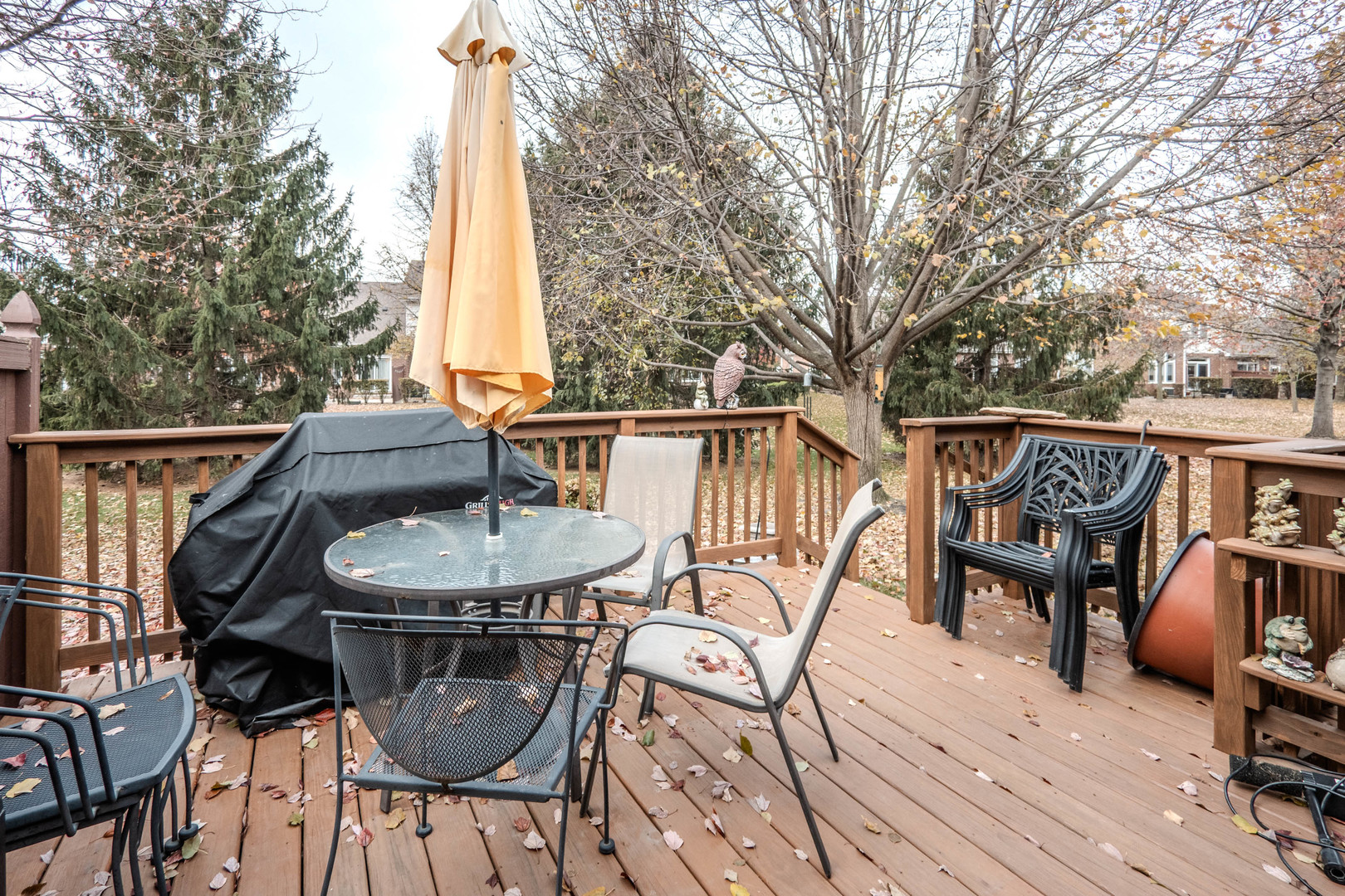 18808 Foxglove Lane Mokena, IL 60448 - Photo 20 of 26 a view of a patio with table and chairs with wooden floor and fence