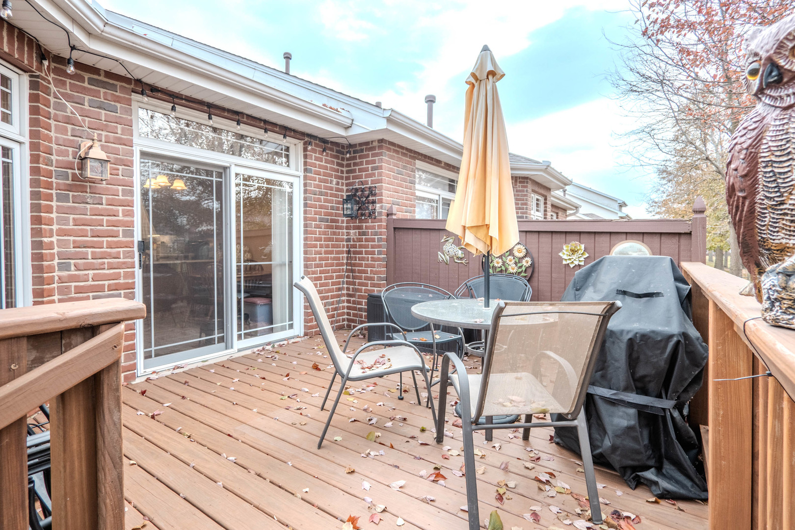 18808 Foxglove Lane Mokena, IL 60448 - Photo 21 of 26 a view of a patio with table and chairs and wooden floor