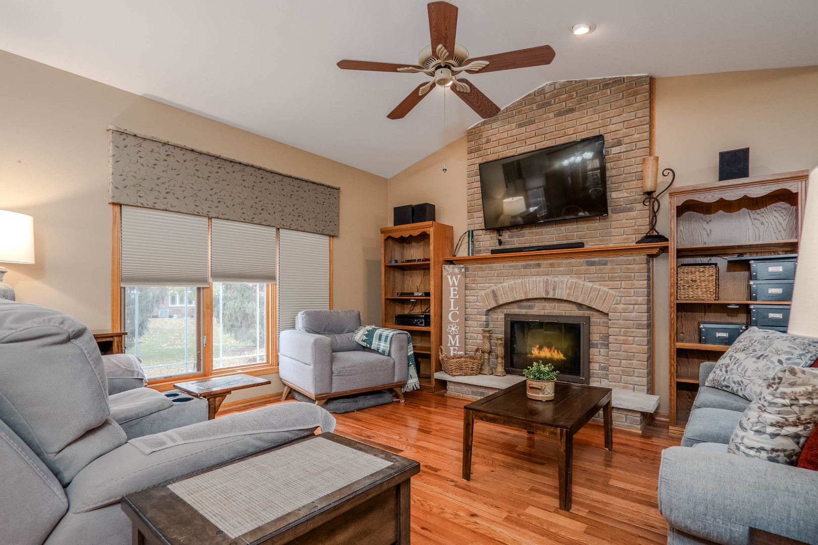 18808 Foxglove Lane Mokena, IL 60448 - Photo 4 of 26 a living room with furniture a flat screen tv and a fireplace