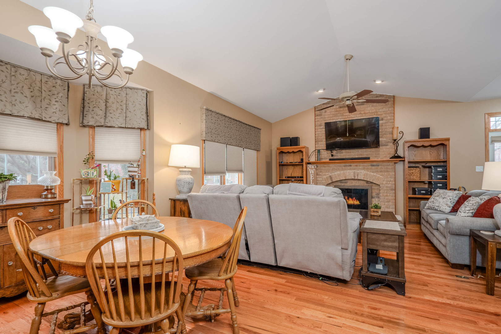18808 Foxglove Lane Mokena, IL 60448 - Photo 7 of 26 a view of a dining room with furniture a chandelier and wooden floor
