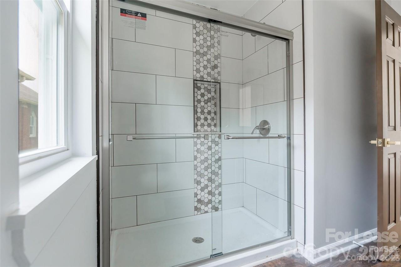 303 Cabarrus Avenue West Concord, NC 28025 - Photo 12 of 17 a bathroom with a shower