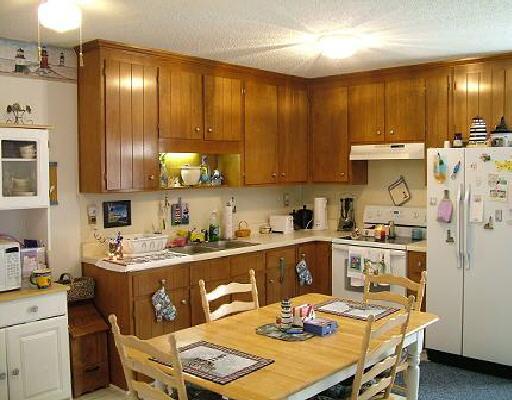 1618 Dugspur Road Callaway, VA 24067 - Photo 2 of 5 a kitchen with a sink a stove and chairs