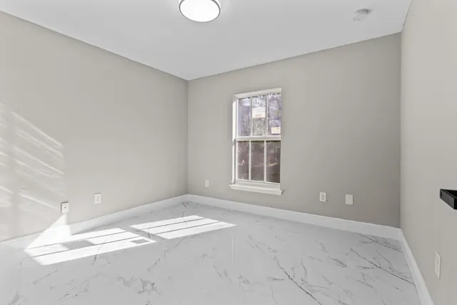 an empty room with windows