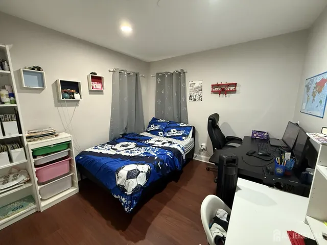 a bedroom with bed and a couch