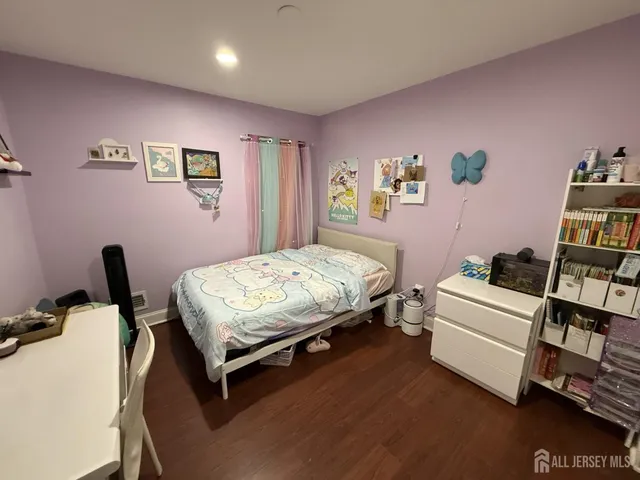 a bedroom with a bed and furniture