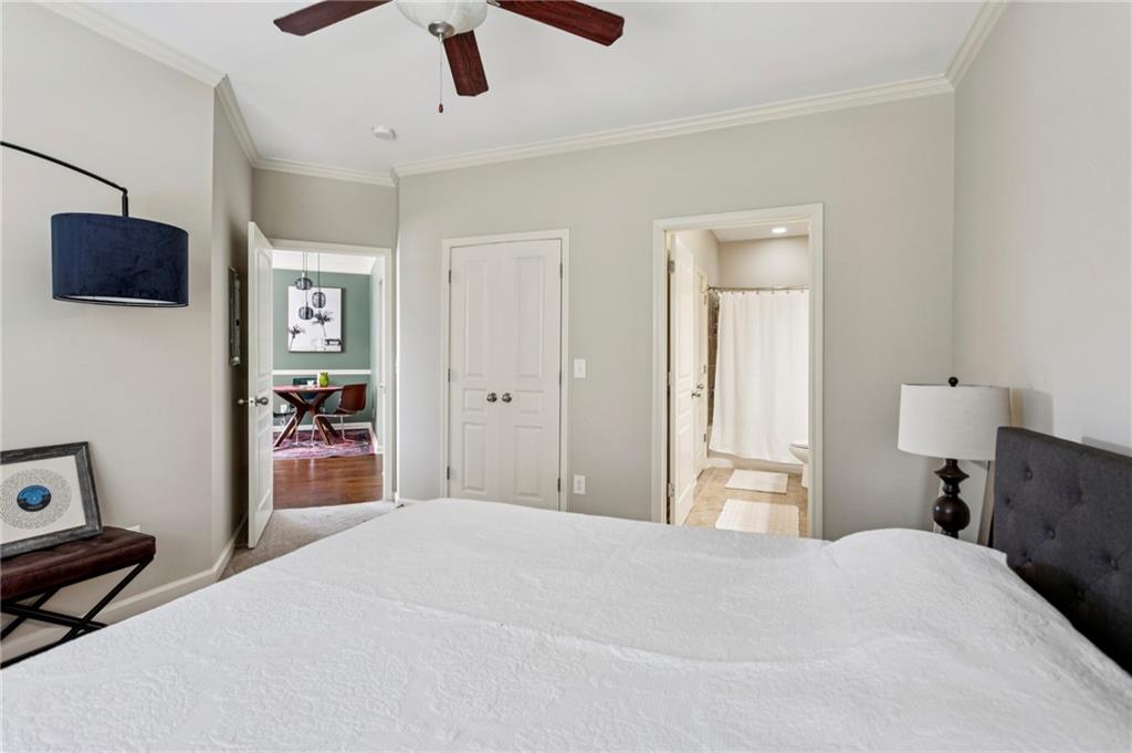 10 Perimeter Summit Boulevard, Unit 4337 Atlanta, GA 30319 - Photo 12 of 21 a bedroom with a bed and a tv