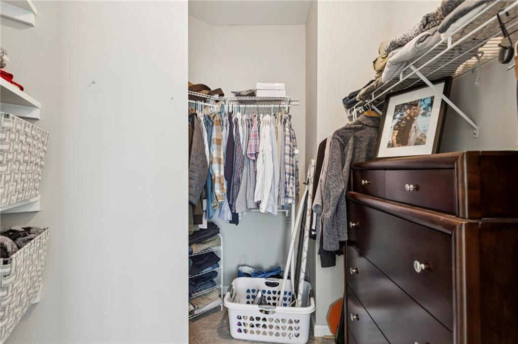 10 Perimeter Summit Boulevard, Unit 4337 Atlanta, GA 30319 - Photo 14 of 21 a view of walk in closet with clothes and shoes