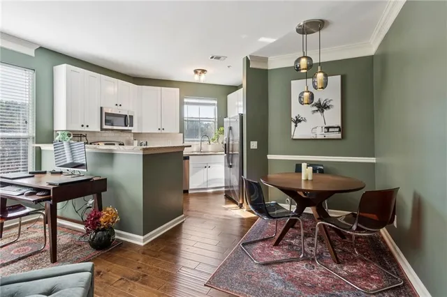 a dining room with furniture and window
