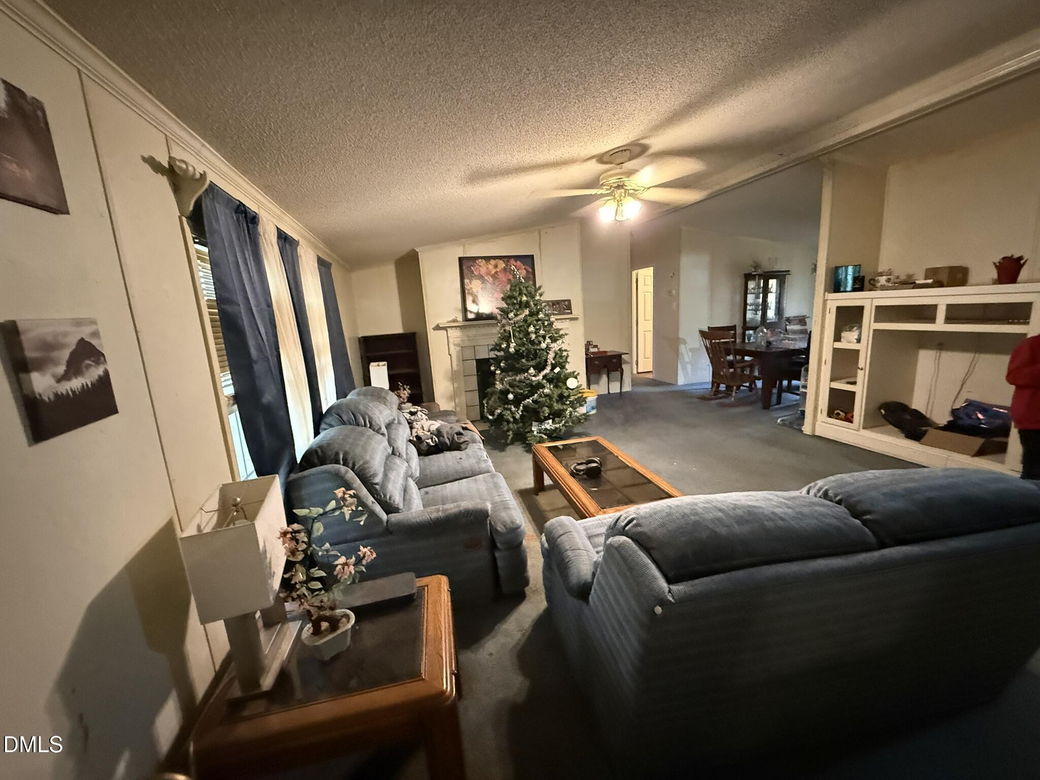 4749 Buckhorn Road Sanford, NC 27330 - Photo 6 of 18 a living room with furniture and a flat screen tv