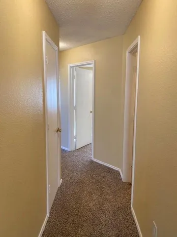 a view of hallway with closet