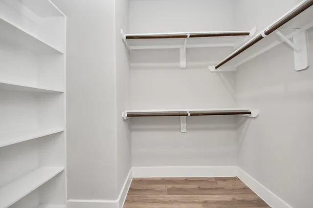 a view of an empty walk in closet